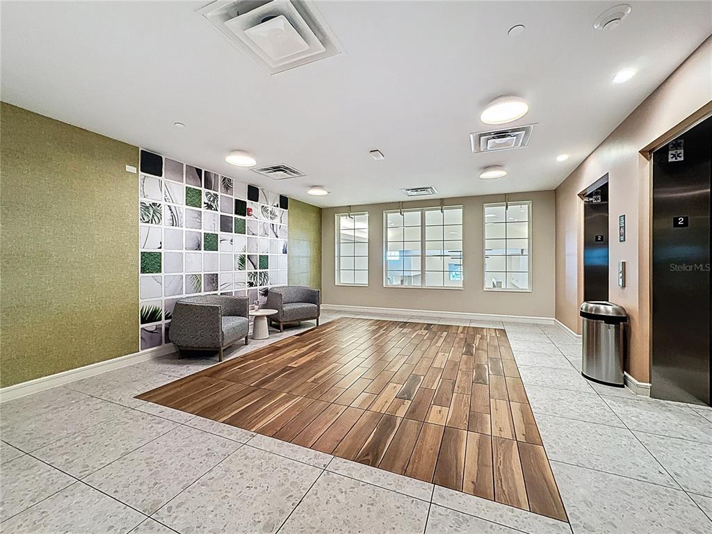3151 Sunset Walk Drive, Unit 204 Kissimmee, FL 34747 - Photo 34 of 58 a spacious bedroom with a large bed and a couch