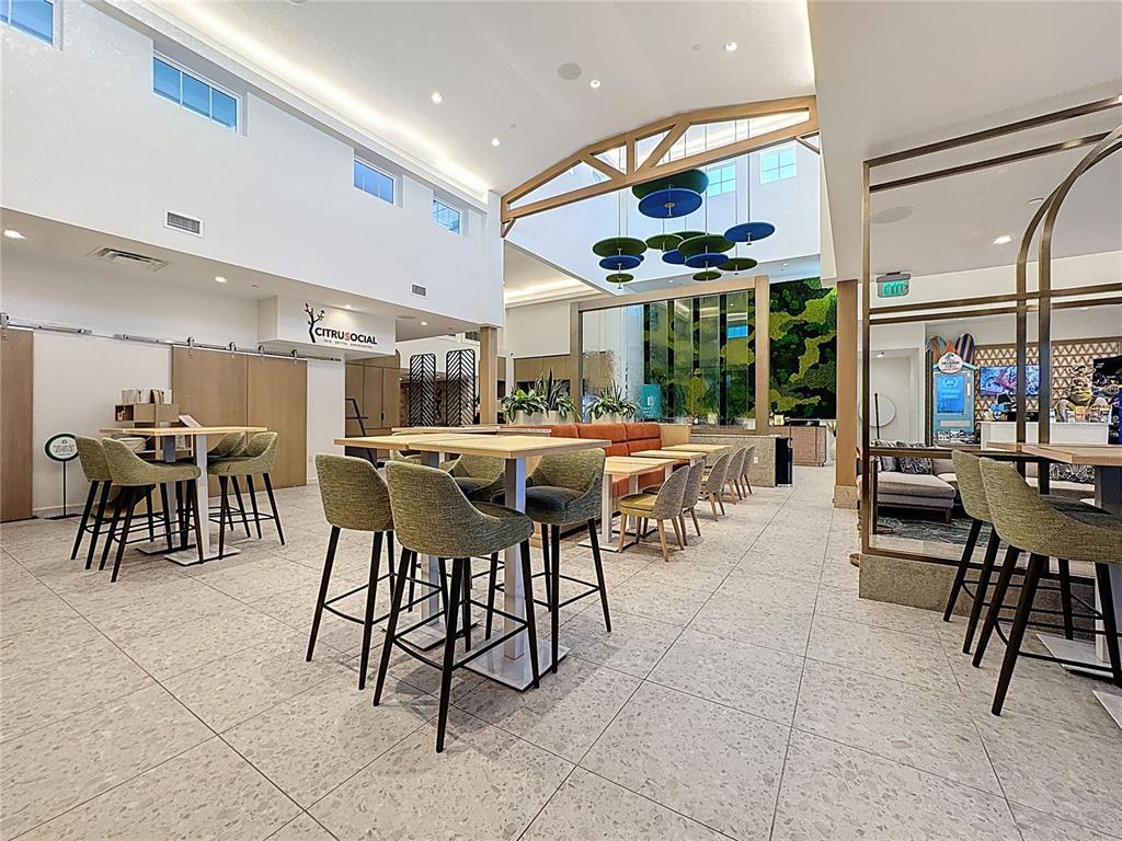 3151 Sunset Walk Drive, Unit 204 Kissimmee, FL 34747 - Photo 39 of 58 a outdoor space with lots of chairs a dining table and chairs