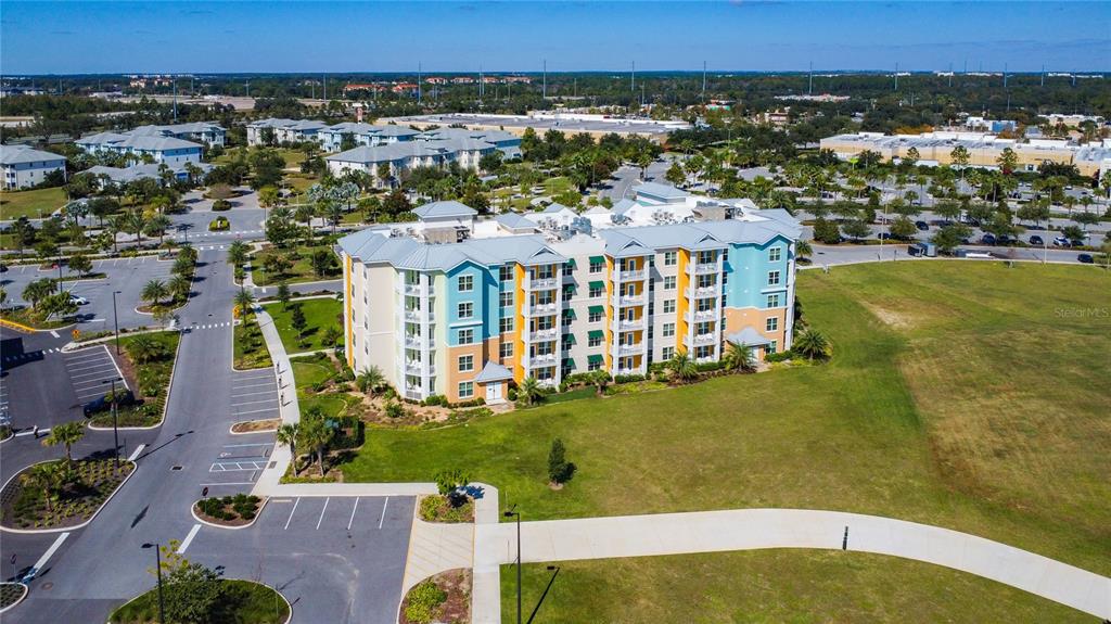 3151 Sunset Walk Drive, Unit 204 Kissimmee, FL 34747 - Photo 45 of 58 a view of a lake with a building in the background