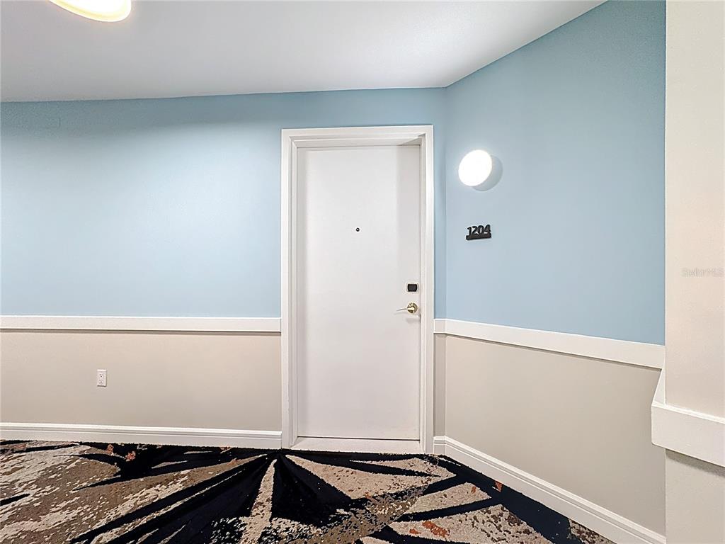 3151 Sunset Walk Drive, Unit 204 Kissimmee, FL 34747 - Photo 5 of 58 a room with a stove and a window