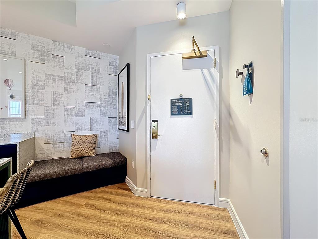 3151 Sunset Walk Drive, Unit 204 Kissimmee, FL 34747 - Photo 6 of 58 a bedroom with a bed and wooden floor