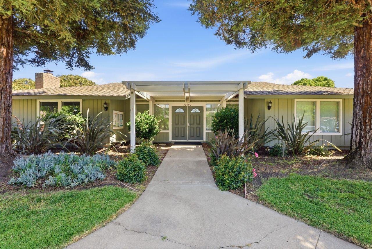 5561 Roundtree Common Fremont, CA 94538 - Photo 27 of 29 a front view of a house with garden