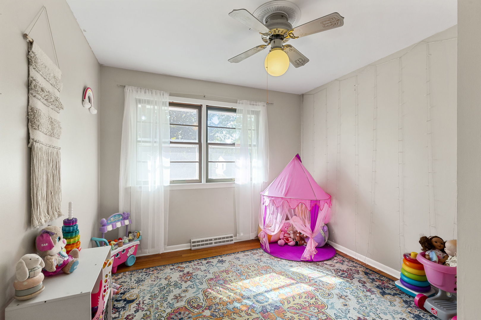 324 Alma Terrace Cary, IL 60013 - Photo 17 of 31 a view of play room with toys and ceiling fan