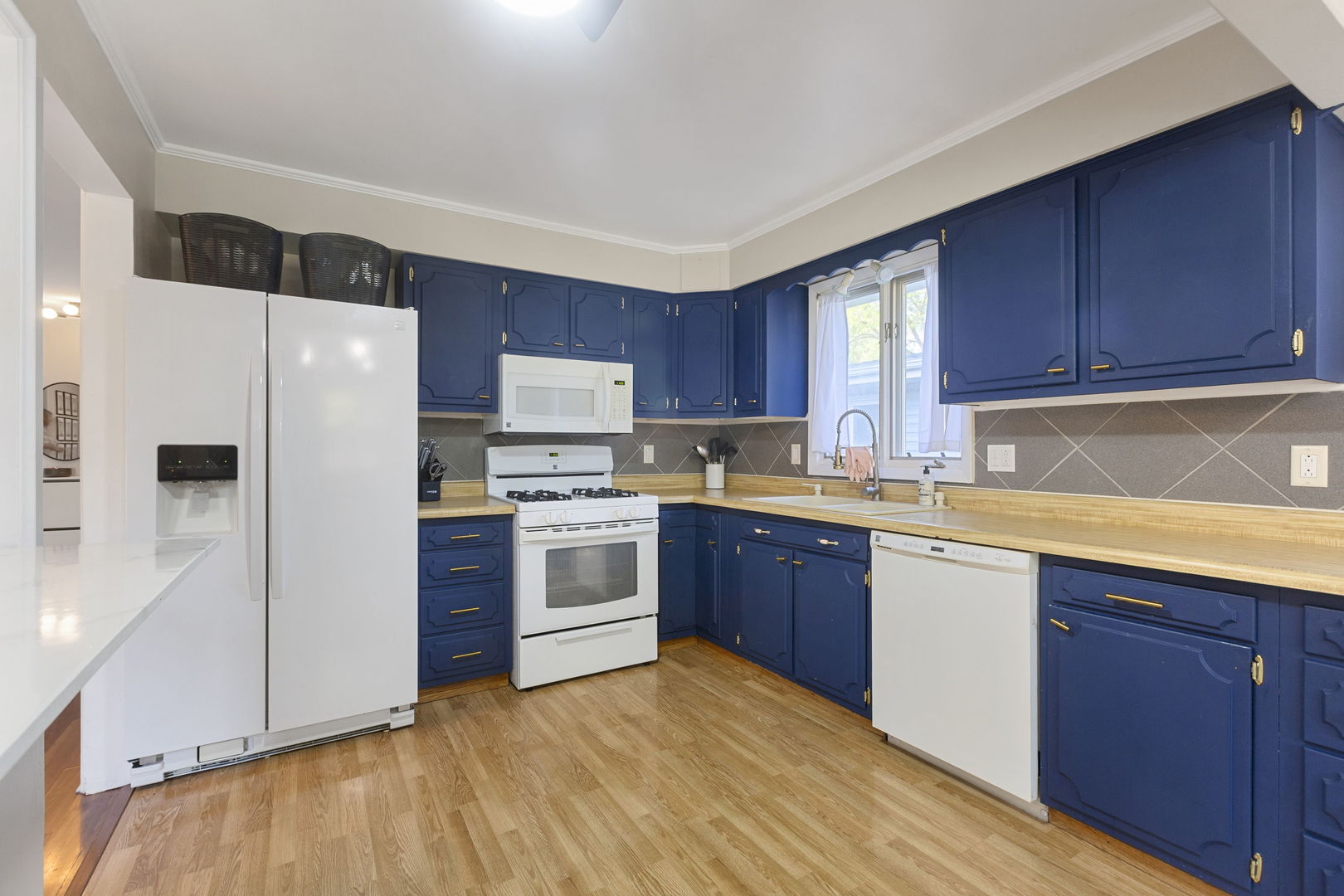 324 Alma Terrace Cary, IL 60013 - Photo 5 of 31 a kitchen with a white cabinets and white appliances