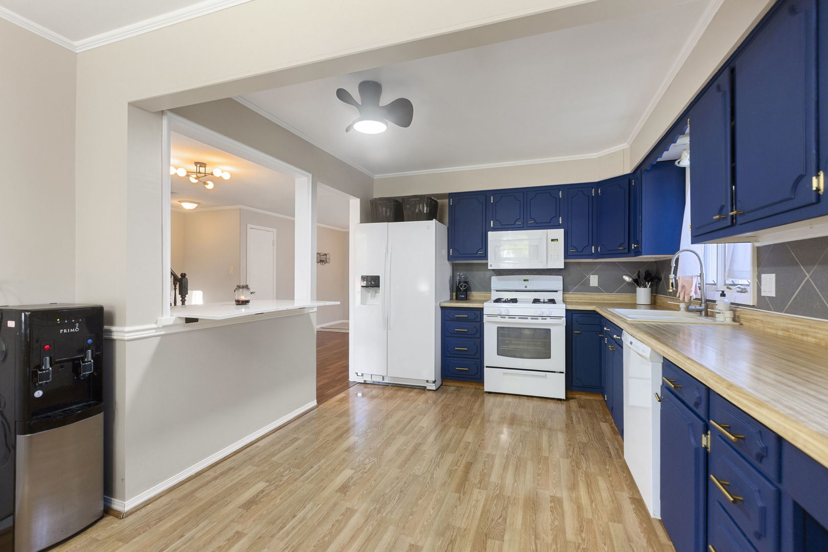 324 Alma Terrace Cary, IL 60013 - Photo 8 of 31 a kitchen with stainless steel appliances wooden floors and wooden cabinets