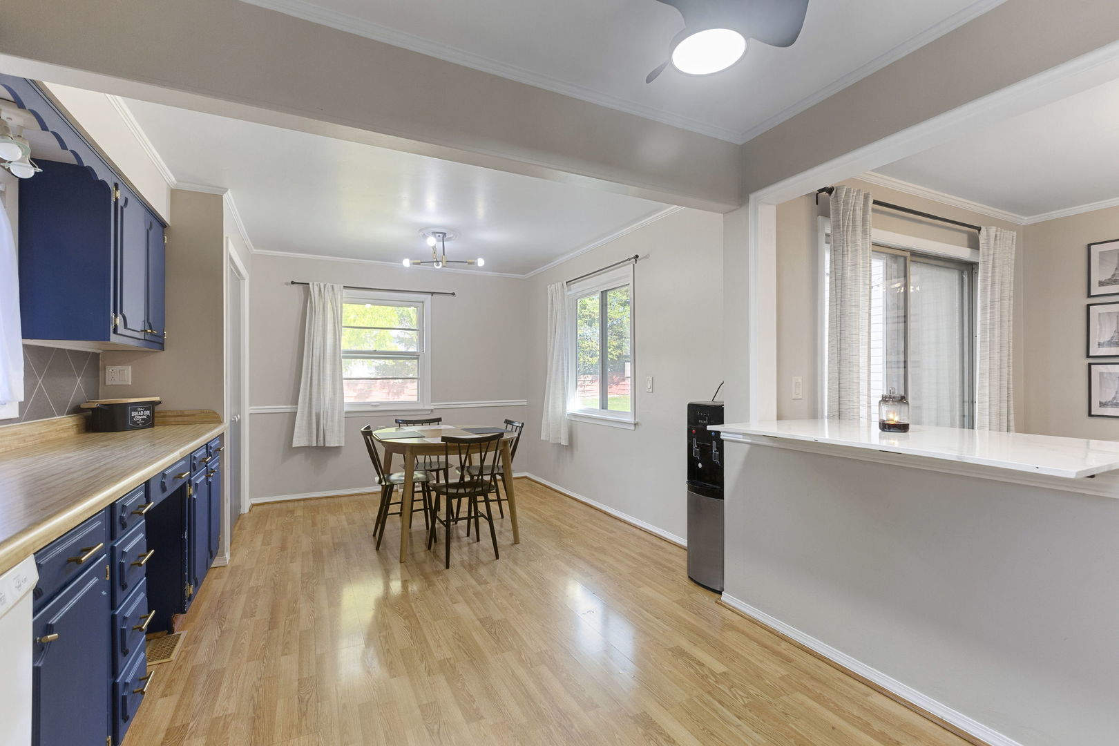 324 Alma Terrace Cary, IL 60013 - Photo 9 of 31 a dining room with wooden floor and stainless steel appliances