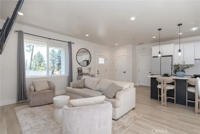 a dining room with furniture and glass door