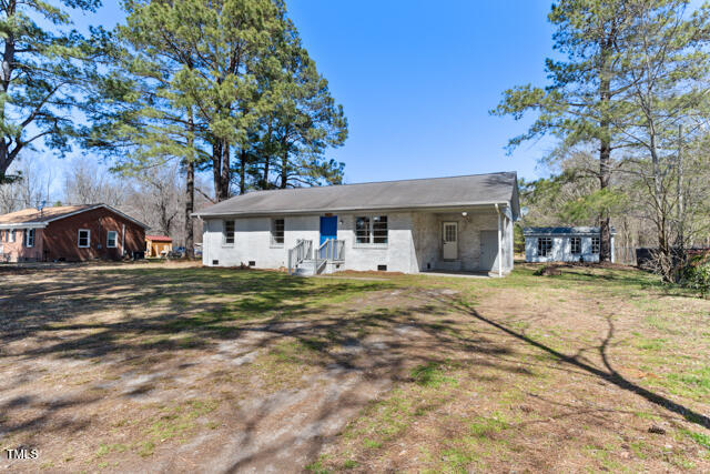 1512 Broken Road Bailey, NC 27807 - Photo 2 of 26 a front view of a house with a garden