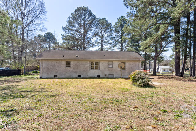 1512 Broken Road Bailey, NC 27807 - Photo 8 of 26 a front view of a house with a yard covered in snow