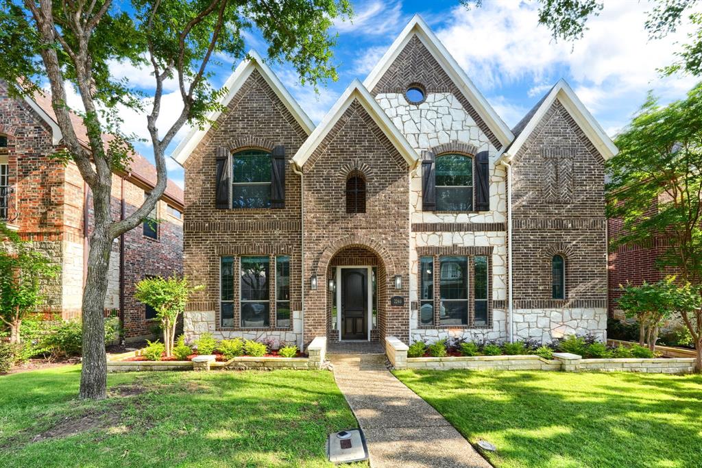 2246 Longview Road Irving, TX 75063 - Photo 1 of 40 Brick and stone facade featuring multiple gables and arched entry