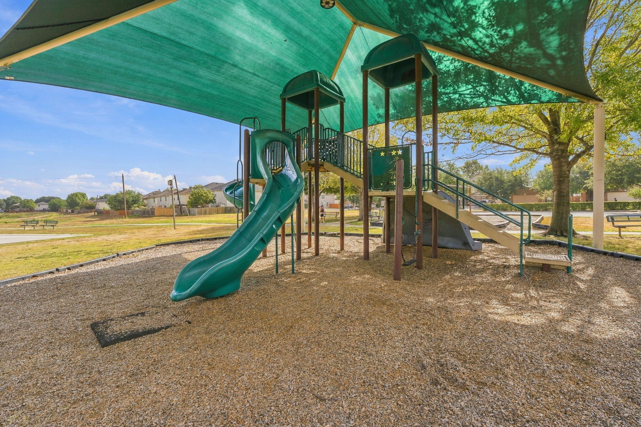 9004 Wiley Way Austin, TX 78747 - Photo 33 of 39 A shaded playground structure stands ready for outdoor recreation.