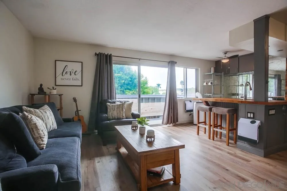 a living room with furniture and a table
