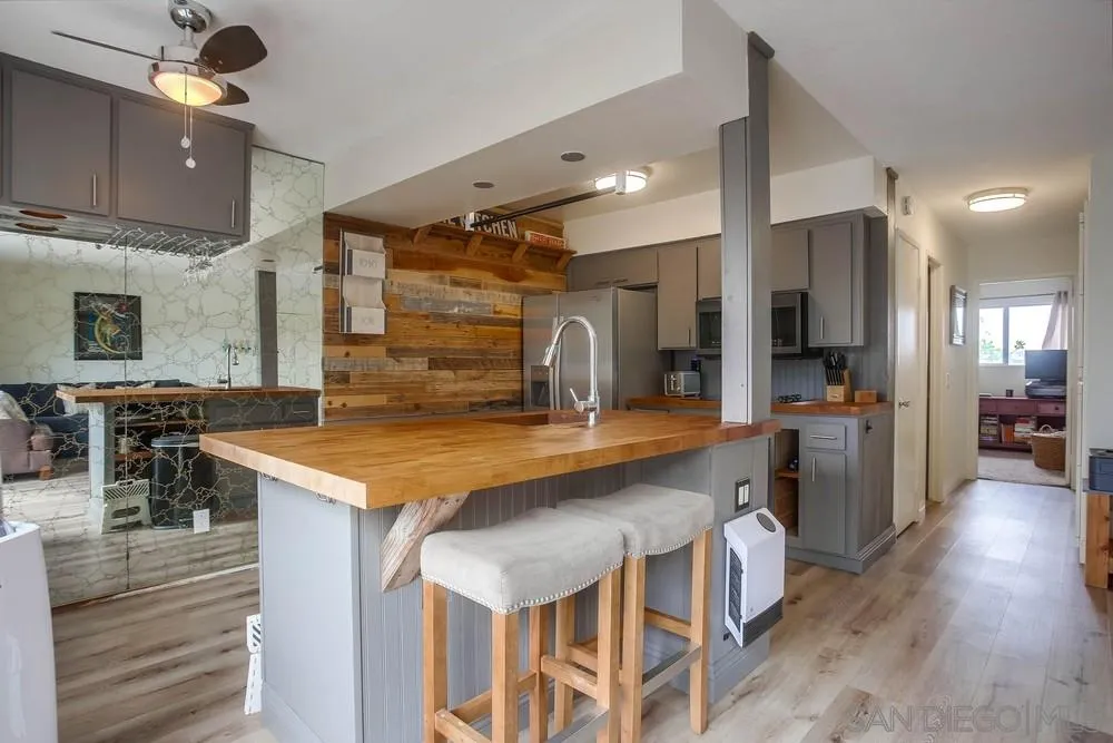 640 East Solana Circle Solana Beach, CA 92075 - Photo 4 of 15 a large kitchen with a table and chairs