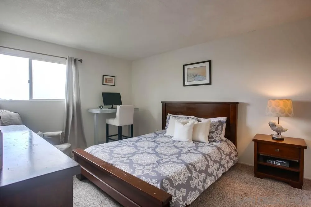 640 East Solana Circle Solana Beach, CA 92075 - Photo 5 of 15 a bedroom with a bed and a table