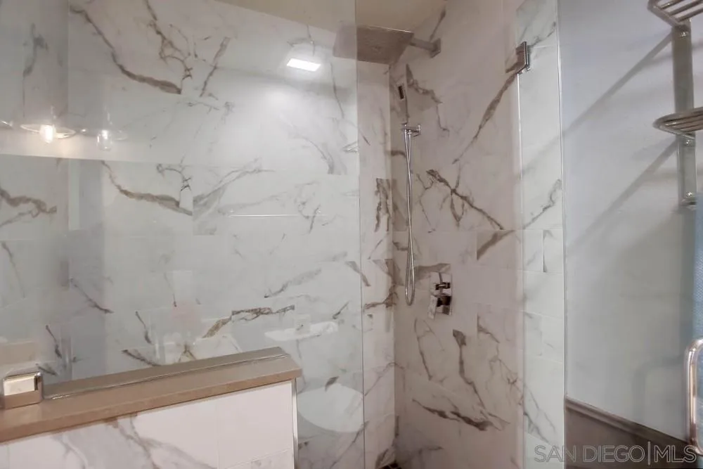 640 East Solana Circle Solana Beach, CA 92075 - Photo 6 of 15 a bathroom with a granite countertop sink a toilet and shower