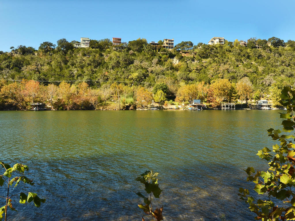 14108 Flat Top Ranch Road Austin, TX 78732 - Photo 1 of 1 a view of a ocean with boats in the background