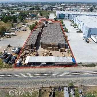 an aerial view of a house with a swimming pool and outdoor seating