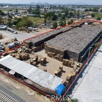 an aerial view of a house with table and chairs