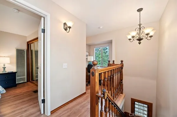 a view of an entryway with wooden floor