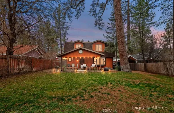 a view of a house with a yard porch and sitting area