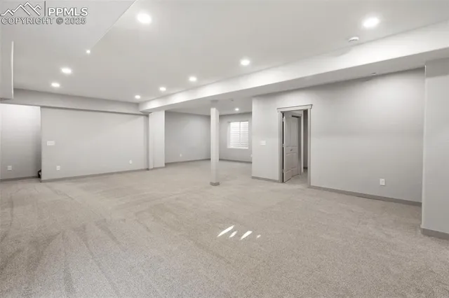 a view of a terrace with lawn chairs and wooden floor