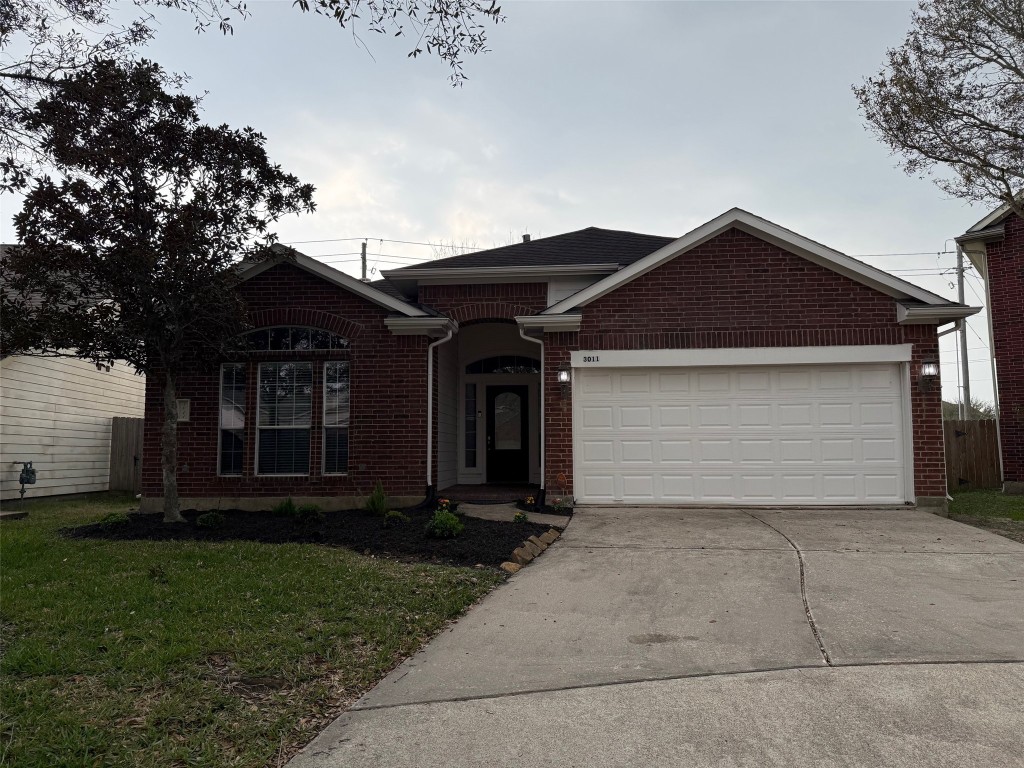 3011 Grovewick Lane Dickinson, TX 77539 - Photo 1 of 28 front view of house with a yard