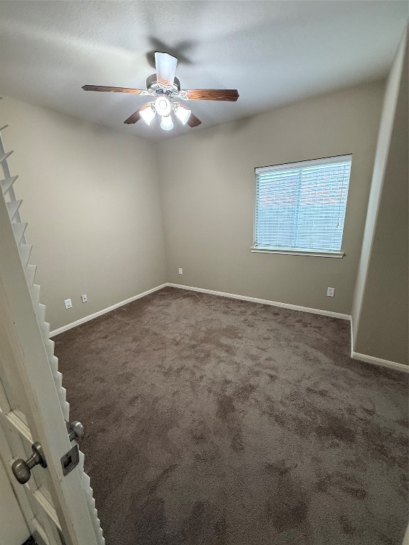 3011 Grovewick Lane Dickinson, TX 77539 - Photo 16 of 28 an empty room with a chandelier fan and windows