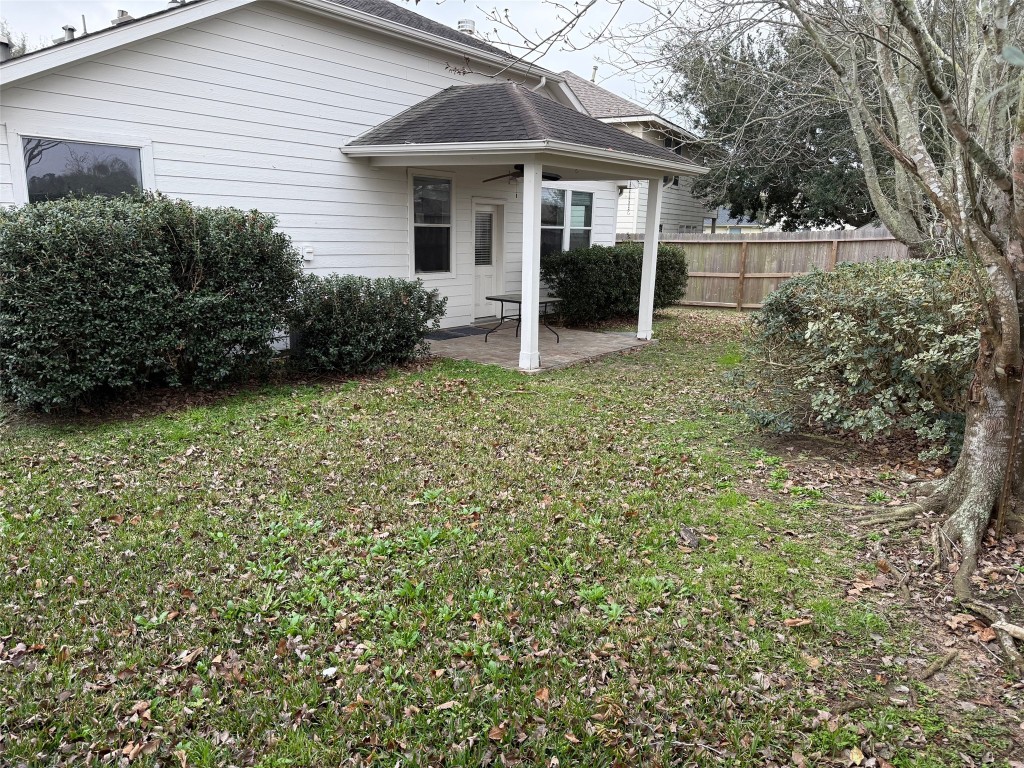 3011 Grovewick Lane Dickinson, TX 77539 - Photo 25 of 28 a view of a white house with a small yard and large tree