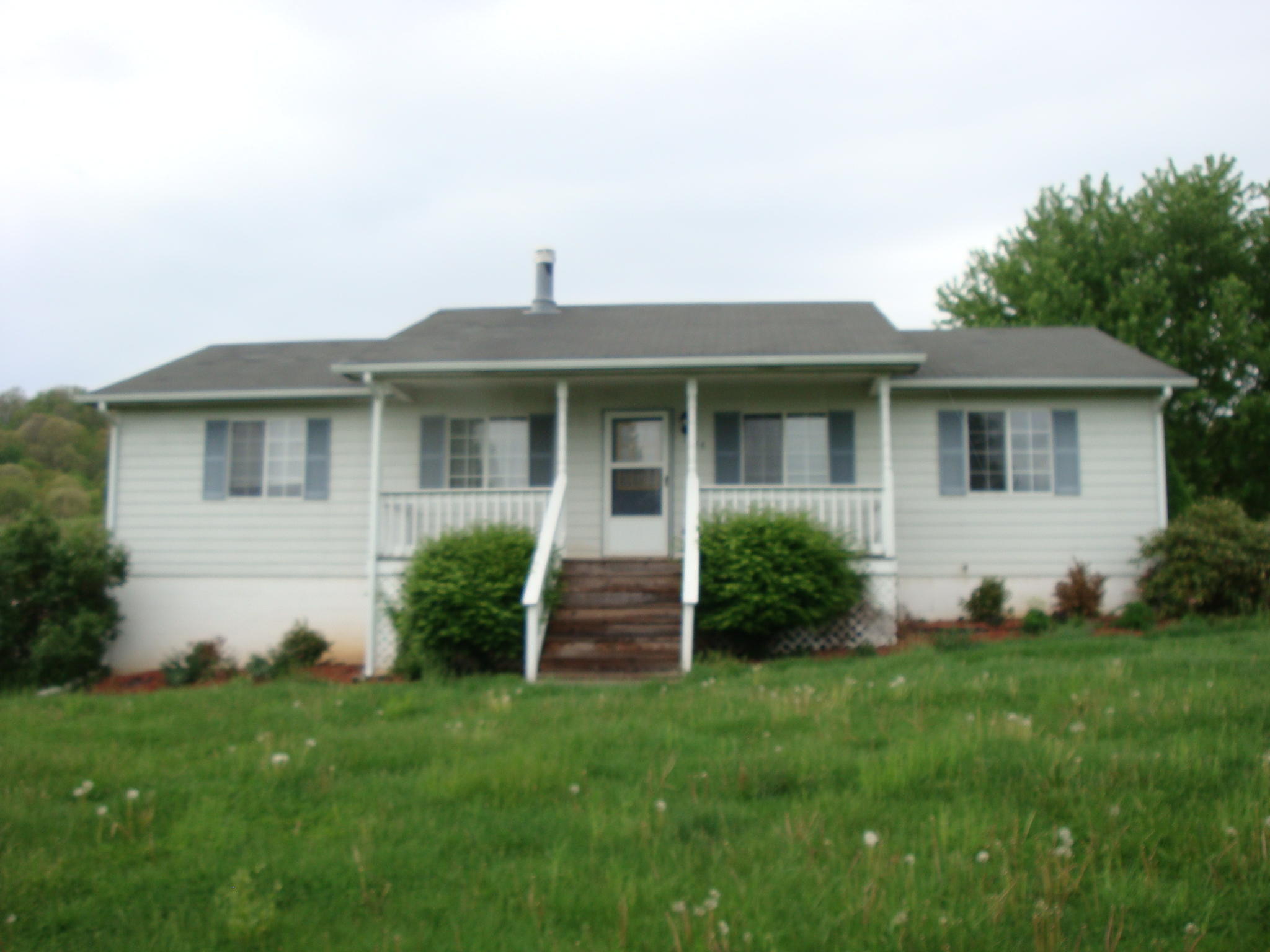 1548 Poff School Road Riner, VA 24149 - Photo 1 of 1 a front view of a house with a yard