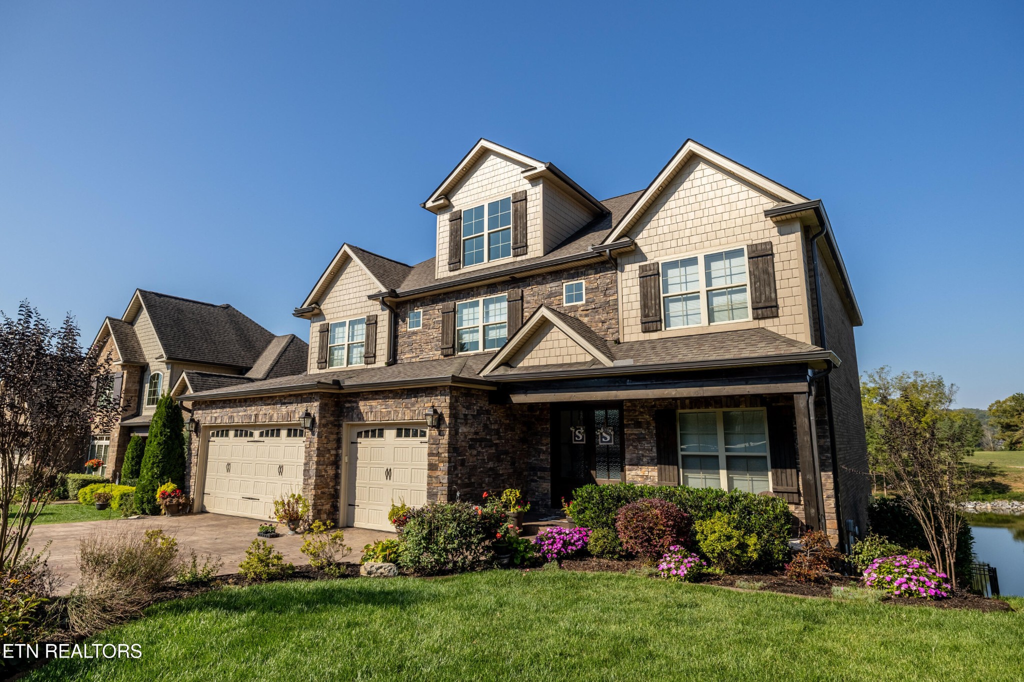 3109 Gazebo Point Way Knoxville, TN 37920 - Photo 1 of 57 a front view of a house with a garden and plants
