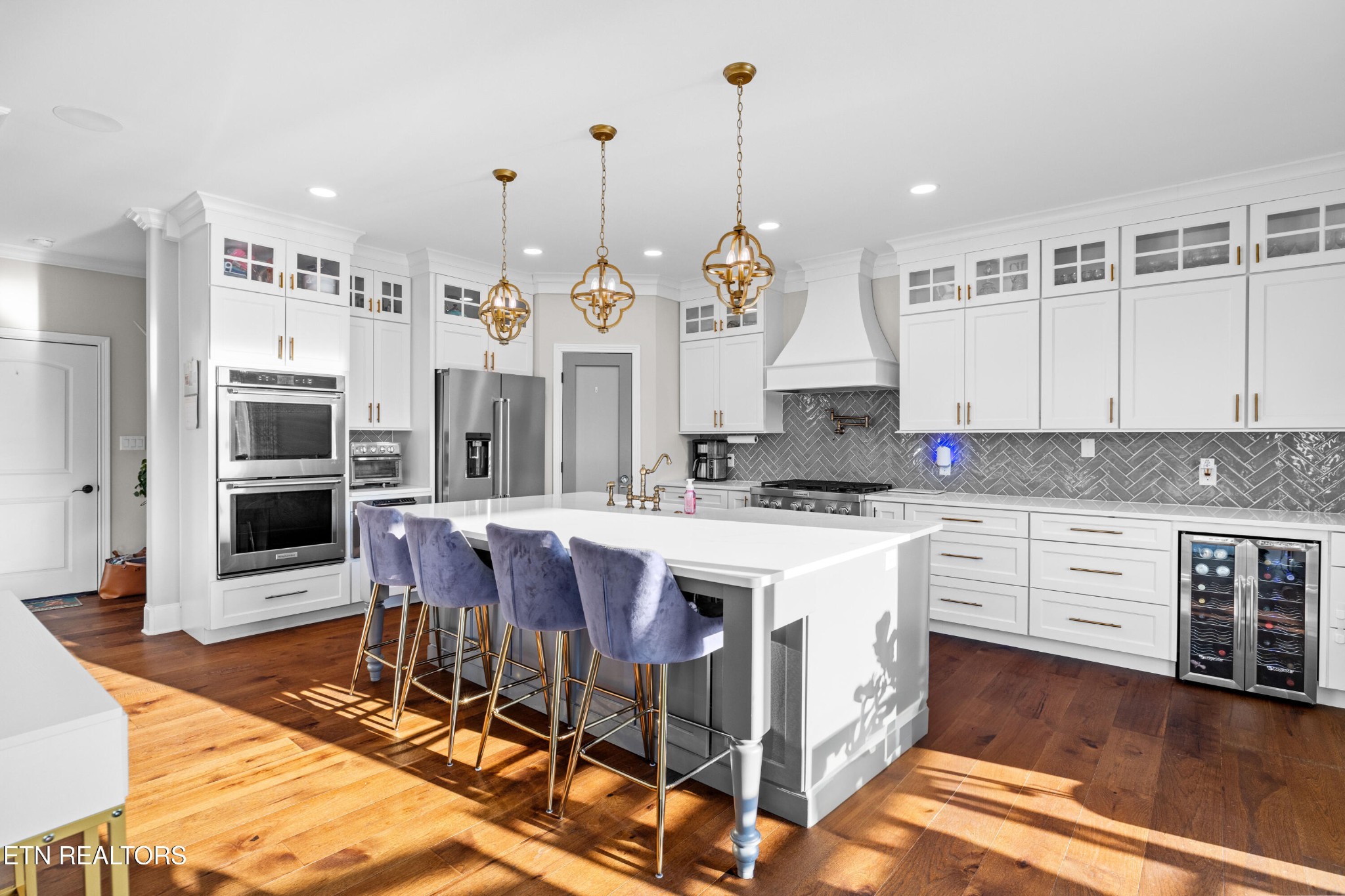 3109 Gazebo Point Way Knoxville, TN 37920 - Photo 21 of 57 a large kitchen with stainless steel appliances kitchen island granite countertop a stove a sink dishwasher and a wooden cabinets with wooden floor