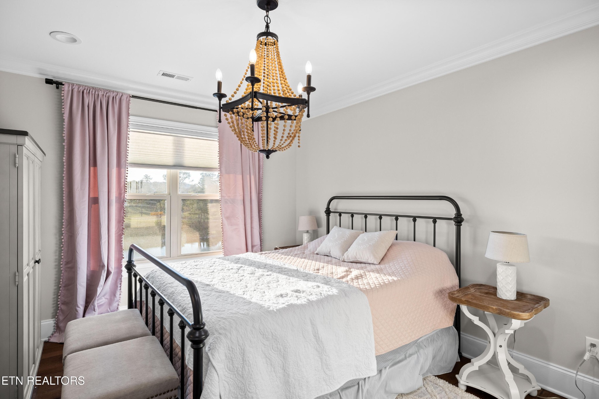 3109 Gazebo Point Way Knoxville, TN 37920 - Photo 29 of 57 a bedroom with a bed a chandelier and a window