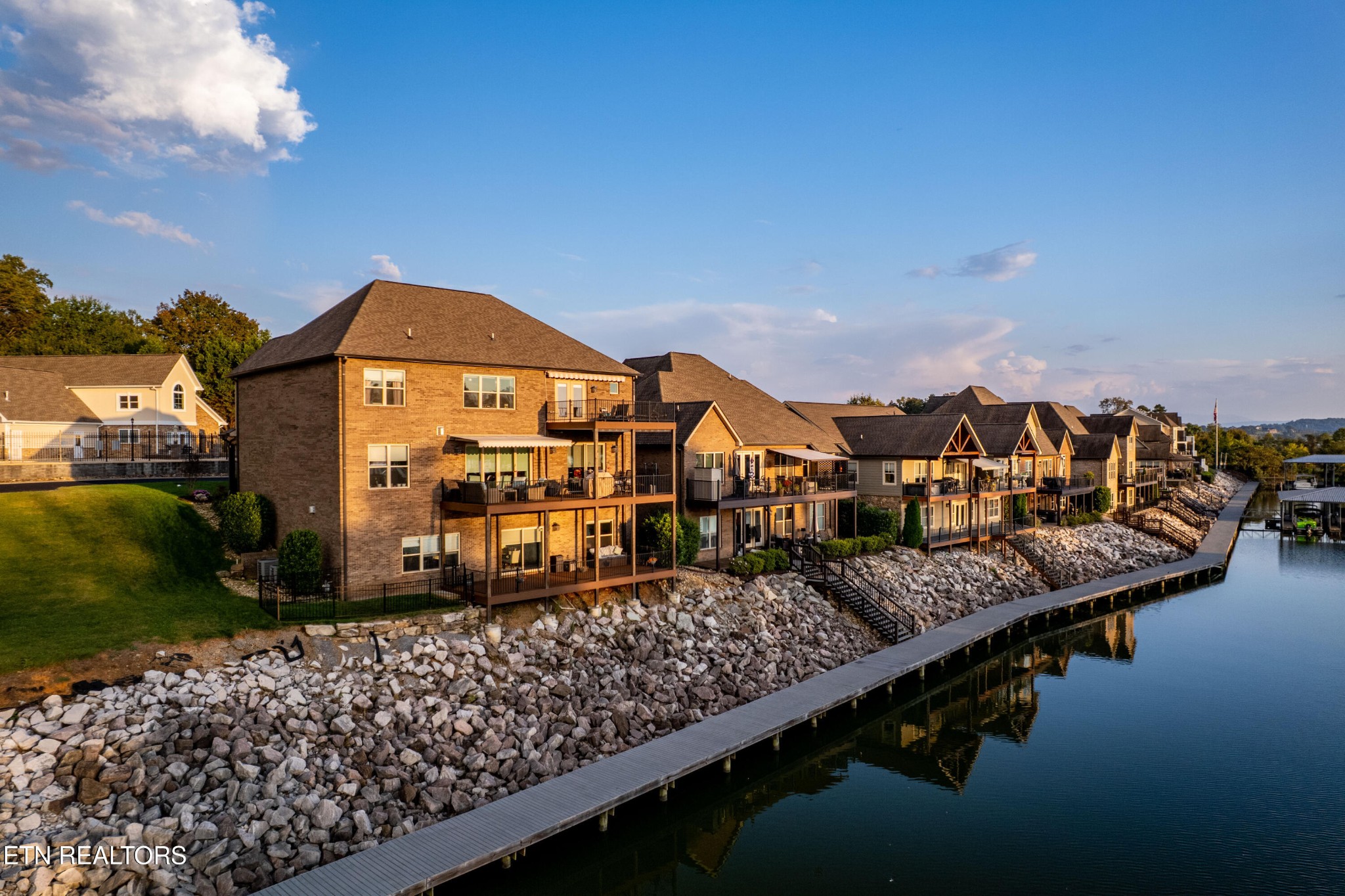 3109 Gazebo Point Way Knoxville, TN 37920 - Photo 46 of 57 a view of a lake with a building in front of it