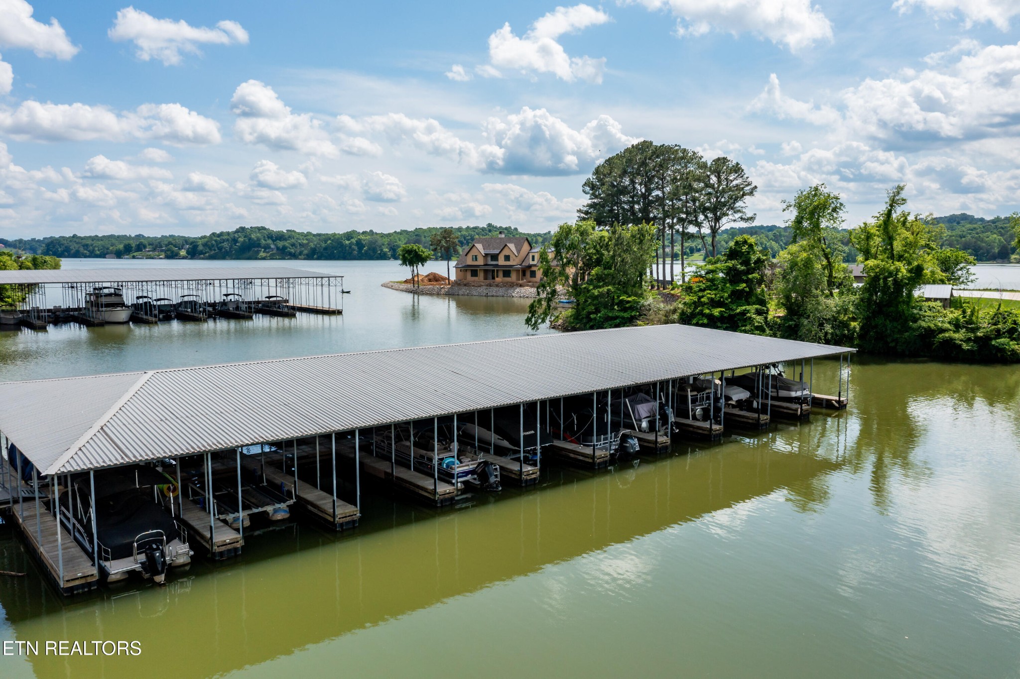 3109 Gazebo Point Way Knoxville, TN 37920 - Photo 48 of 57 a view of a lake with houses in the back