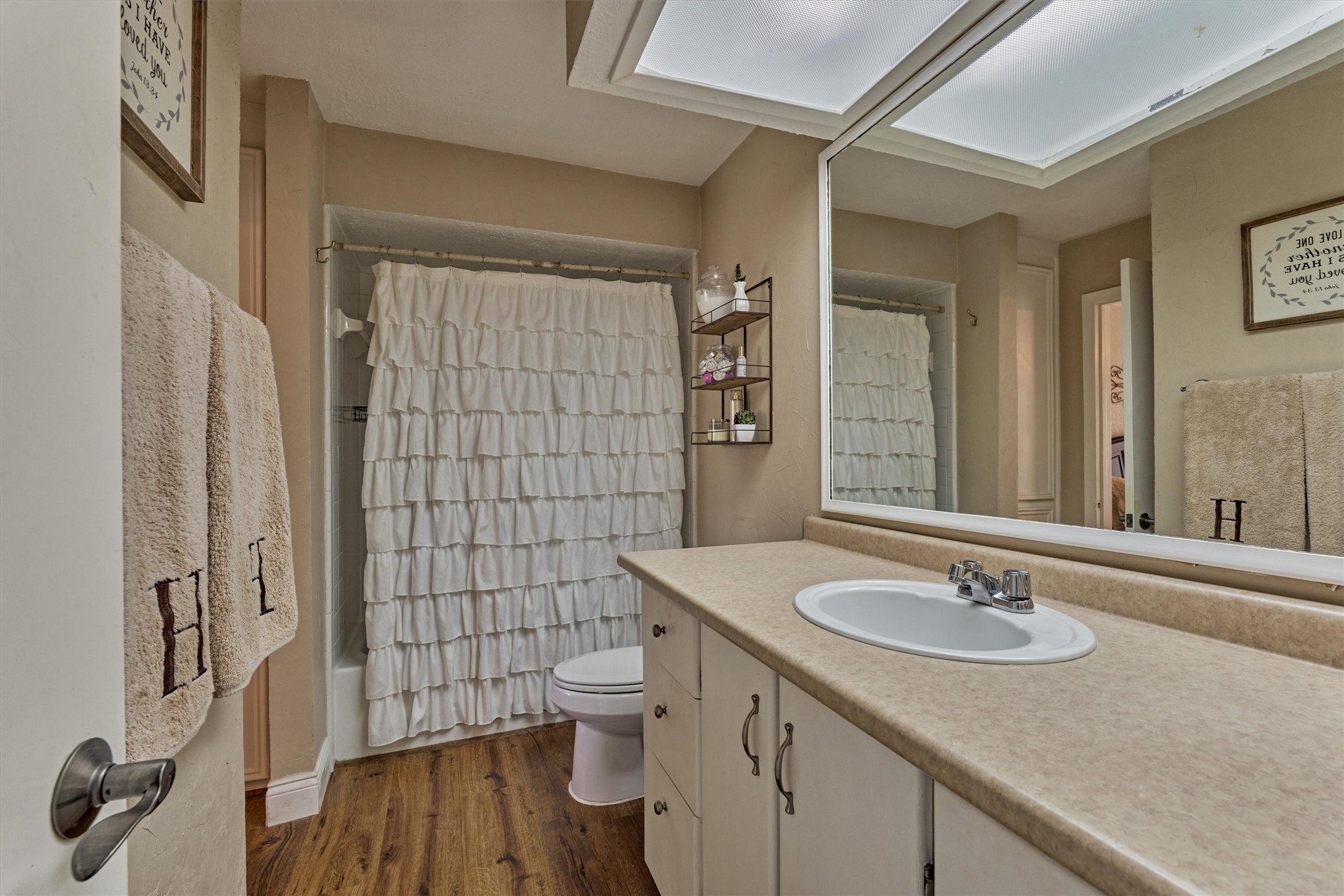 39 Regency Point Conroe, TX 77356 - Photo 28 of 44 a bathroom with a sink a toilet and shower