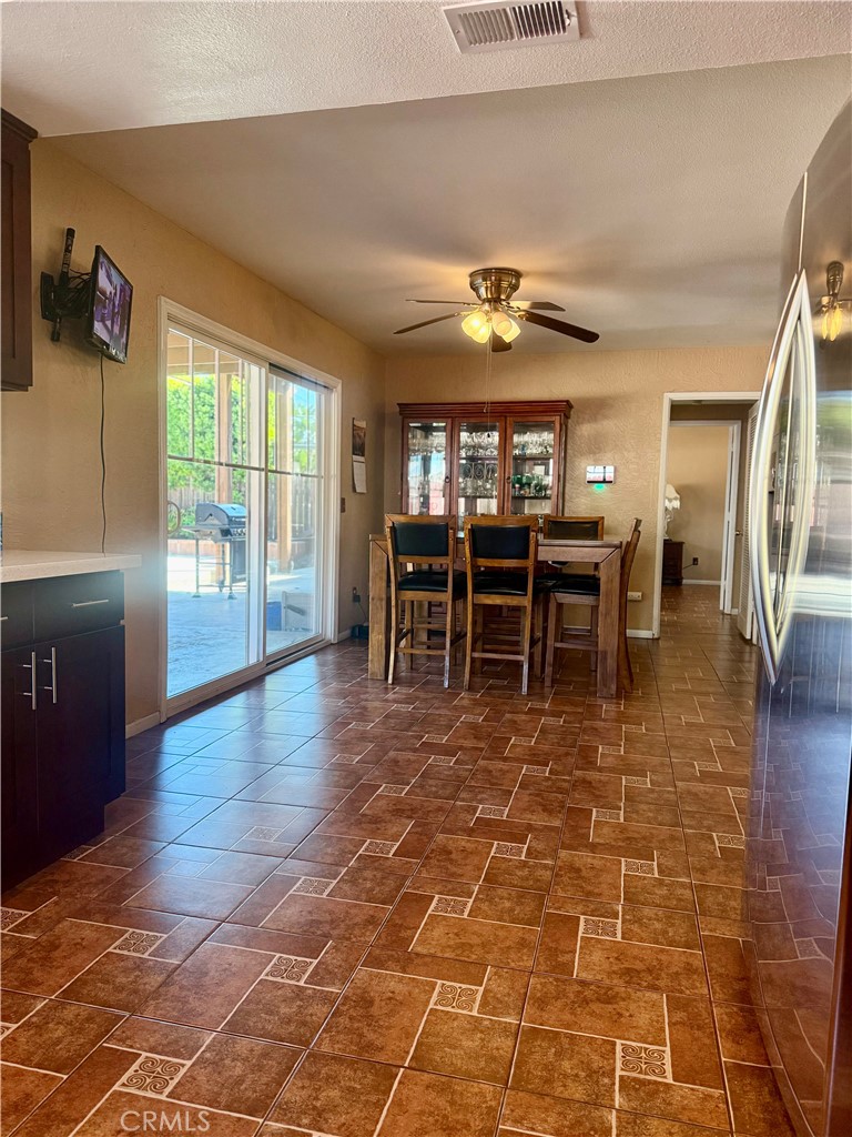 5982 Harrison Street Chino, CA 91710 - Photo 19 of 43 a view of a dining room with furniture and wooden floor