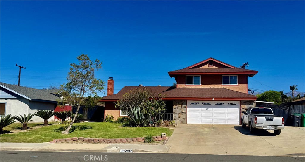 5982 Harrison Street Chino, CA 91710 - Photo 2 of 43 a front view of a house with a yard