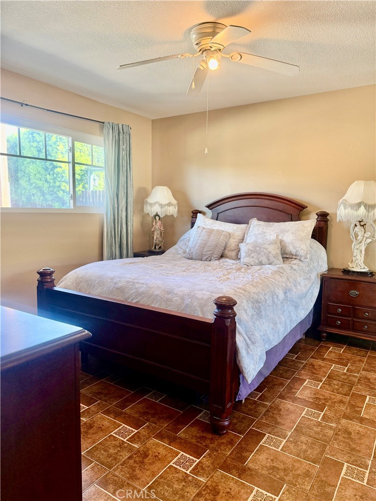 5982 Harrison Street Chino, CA 91710 - Photo 23 of 43 a bedroom with a bed and window