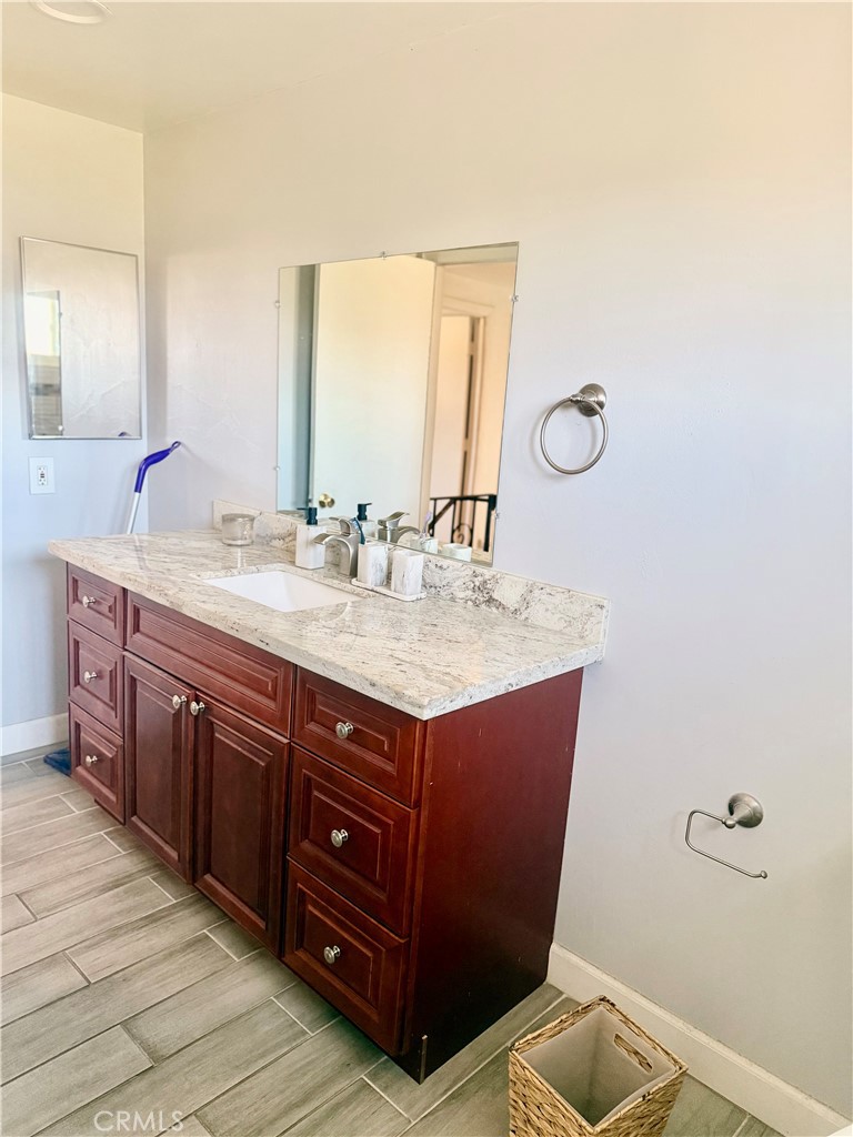 5982 Harrison Street Chino, CA 91710 - Photo 29 of 43 a bathroom with a sink and a mirror
