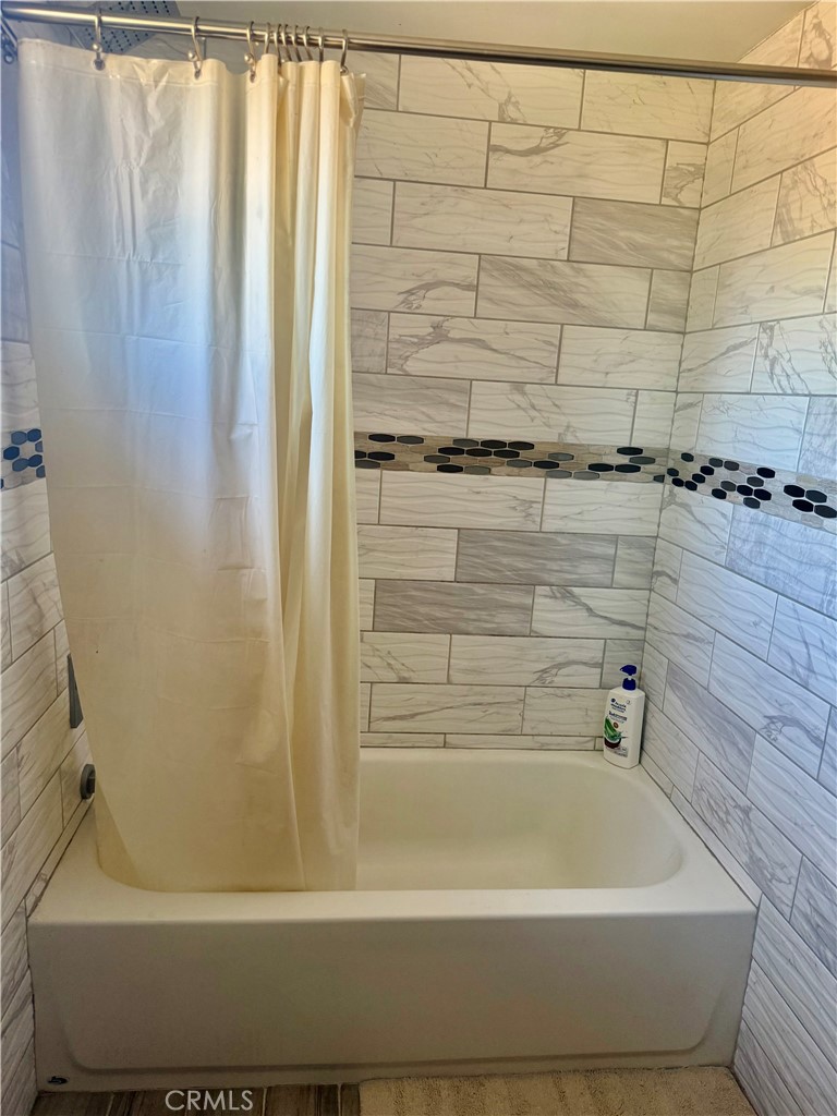 5982 Harrison Street Chino, CA 91710 - Photo 30 of 43 a bathroom with a bathtub