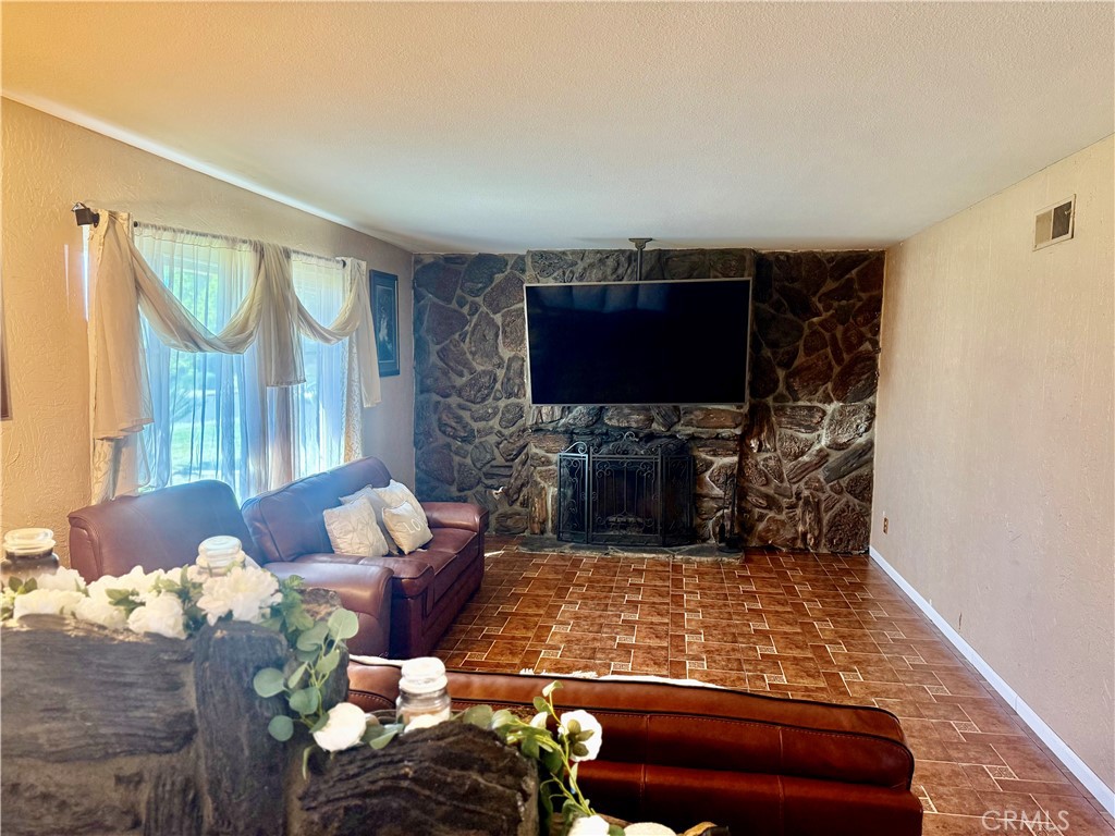 5982 Harrison Street Chino, CA 91710 - Photo 39 of 43 a living room with furniture and a flat screen tv