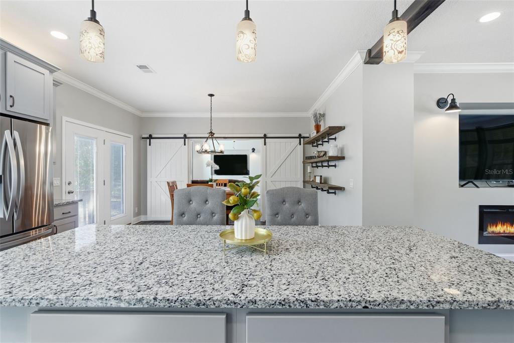 6170 La Pine Road Brooksville, FL 34602 - Photo 16 of 63 a kitchen with a sink a counter top space cabinets and stainless steel appliances