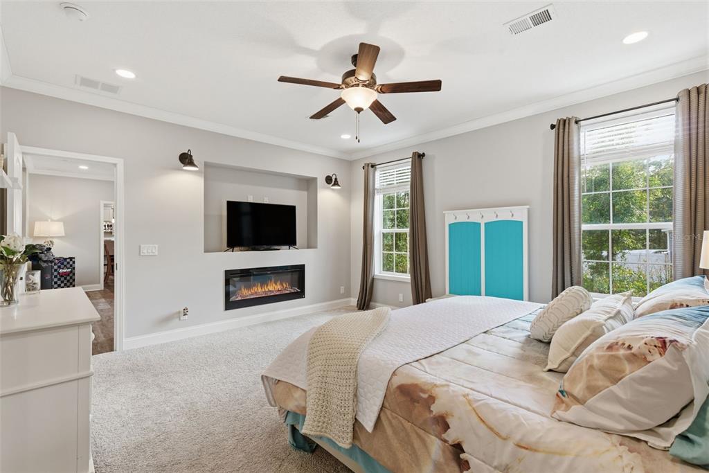 6170 La Pine Road Brooksville, FL 34602 - Photo 23 of 63 a bedroom with a bed and a flat screen tv