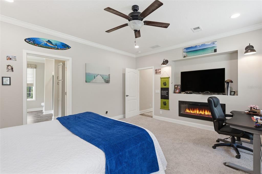 6170 La Pine Road Brooksville, FL 34602 - Photo 30 of 63 a bedroom with a bed and a flat screen tv