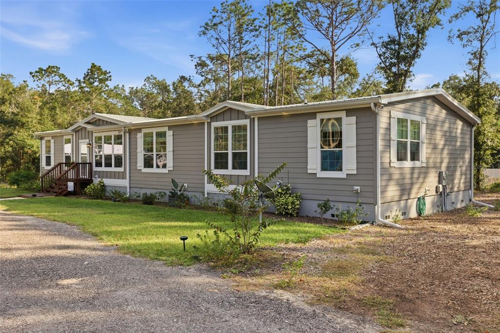 6170 La Pine Road Brooksville, FL 34602 - Photo 49 of 63 front view of a house with a yard