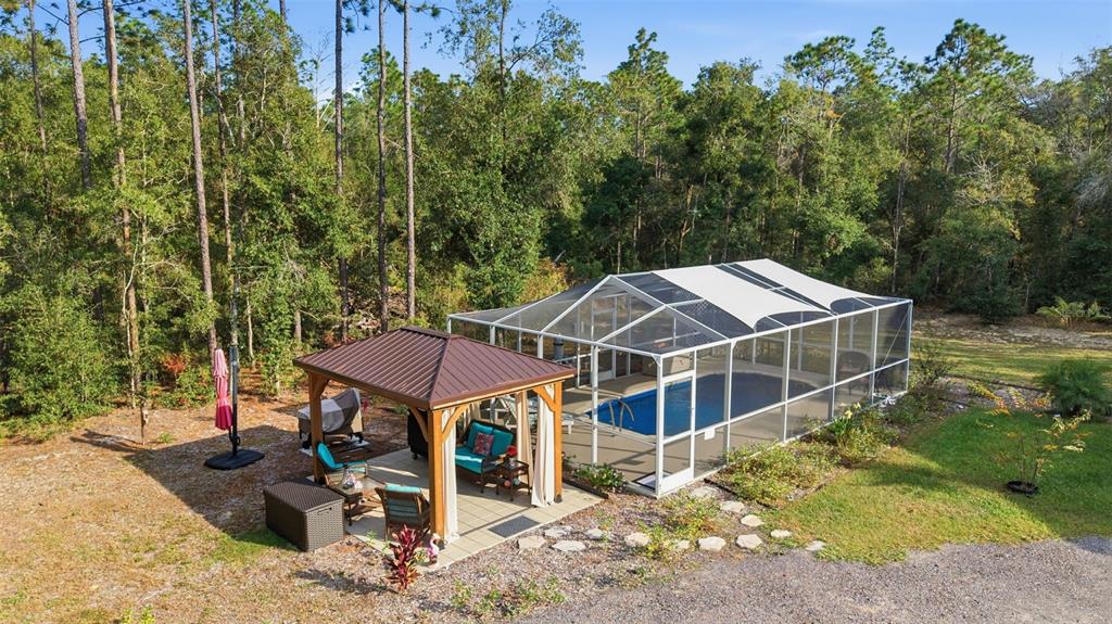 6170 La Pine Road Brooksville, FL 34602 - Photo 5 of 63 aerial view of a house with a yard