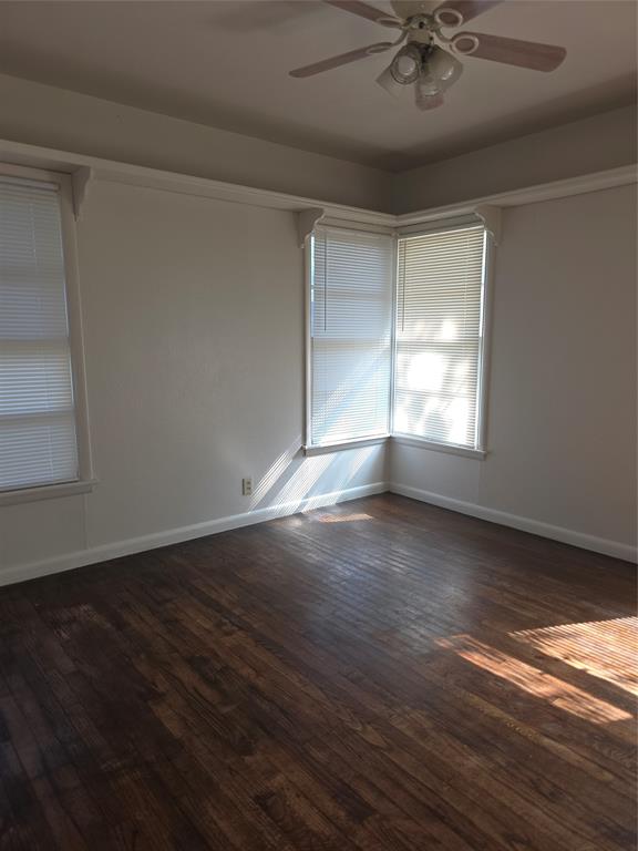 2717 Bilglade Road Fort Worth, TX 76133 - Photo 11 of 13 a view of an empty room with wooden floor and a window