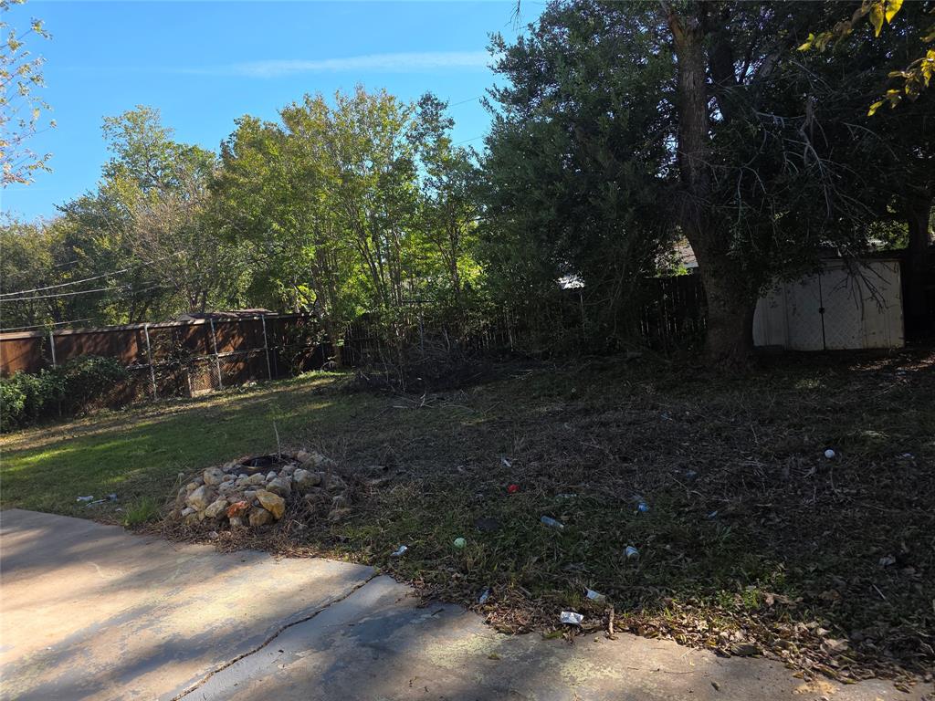 2717 Bilglade Road Fort Worth, TX 76133 - Photo 12 of 13 a view of a street with a yard