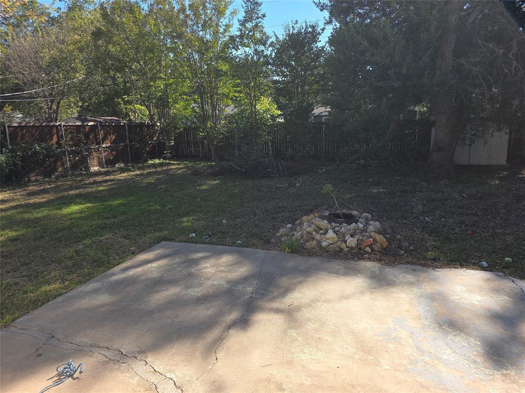 2717 Bilglade Road Fort Worth, TX 76133 - Photo 13 of 13 a view of a yard with potted plants and large trees