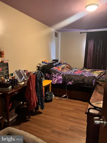 a bedroom with a bed and a closet
